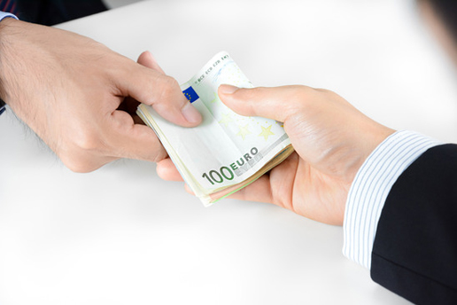 Businessman hands passing money, Euro currency (EUR) - bribery concept